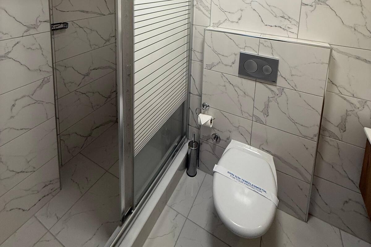 family triple room | bathroom | shower, free toiletries, hair dryer, slippers