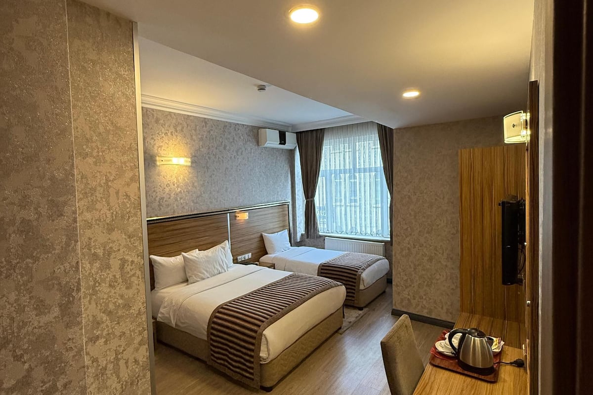 family triple room | 1 bedroom, free minibar items, in-room safe, desk