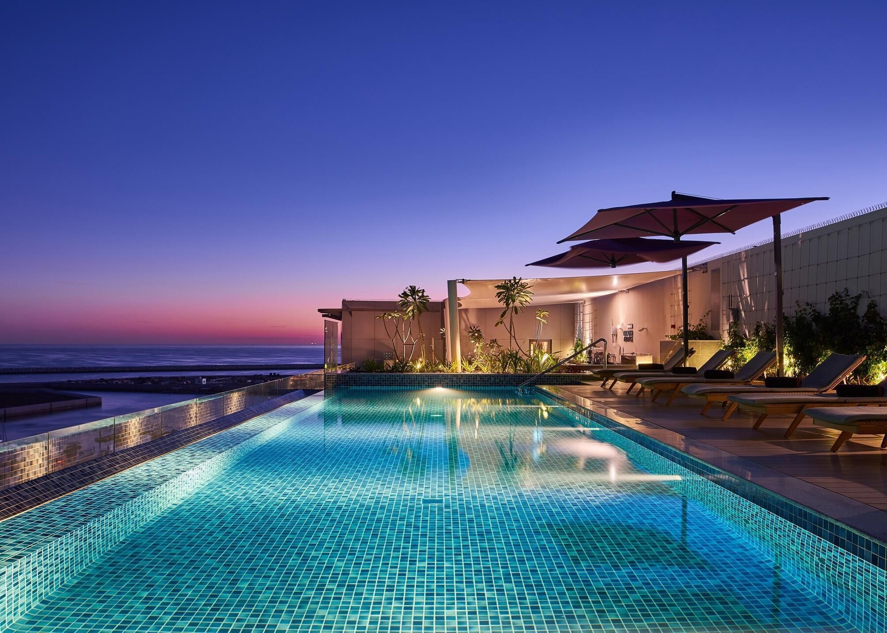 Outdoor pool, open 6:00 AM to 6:00 PM, pool loungers