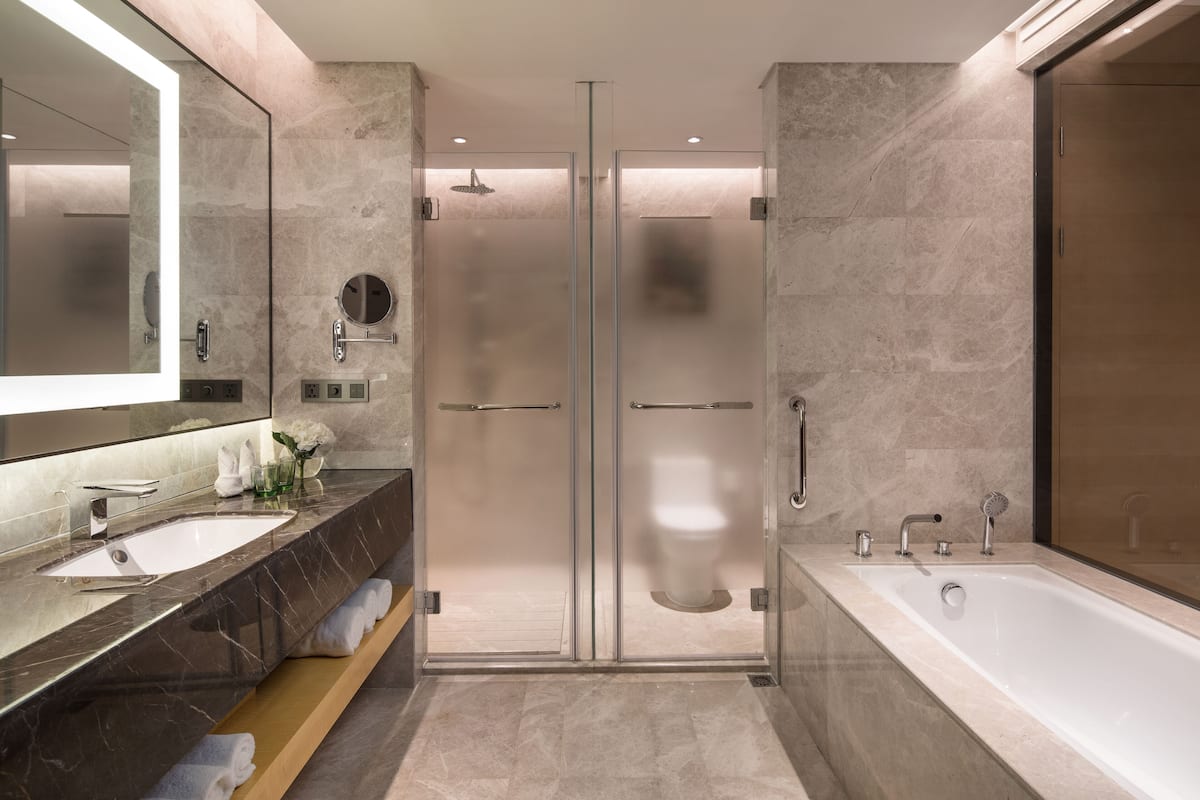 Suite, 1 Bedroom, Lake View | Bathroom | Separate tub and shower, free toiletries, hair dryer, slippers