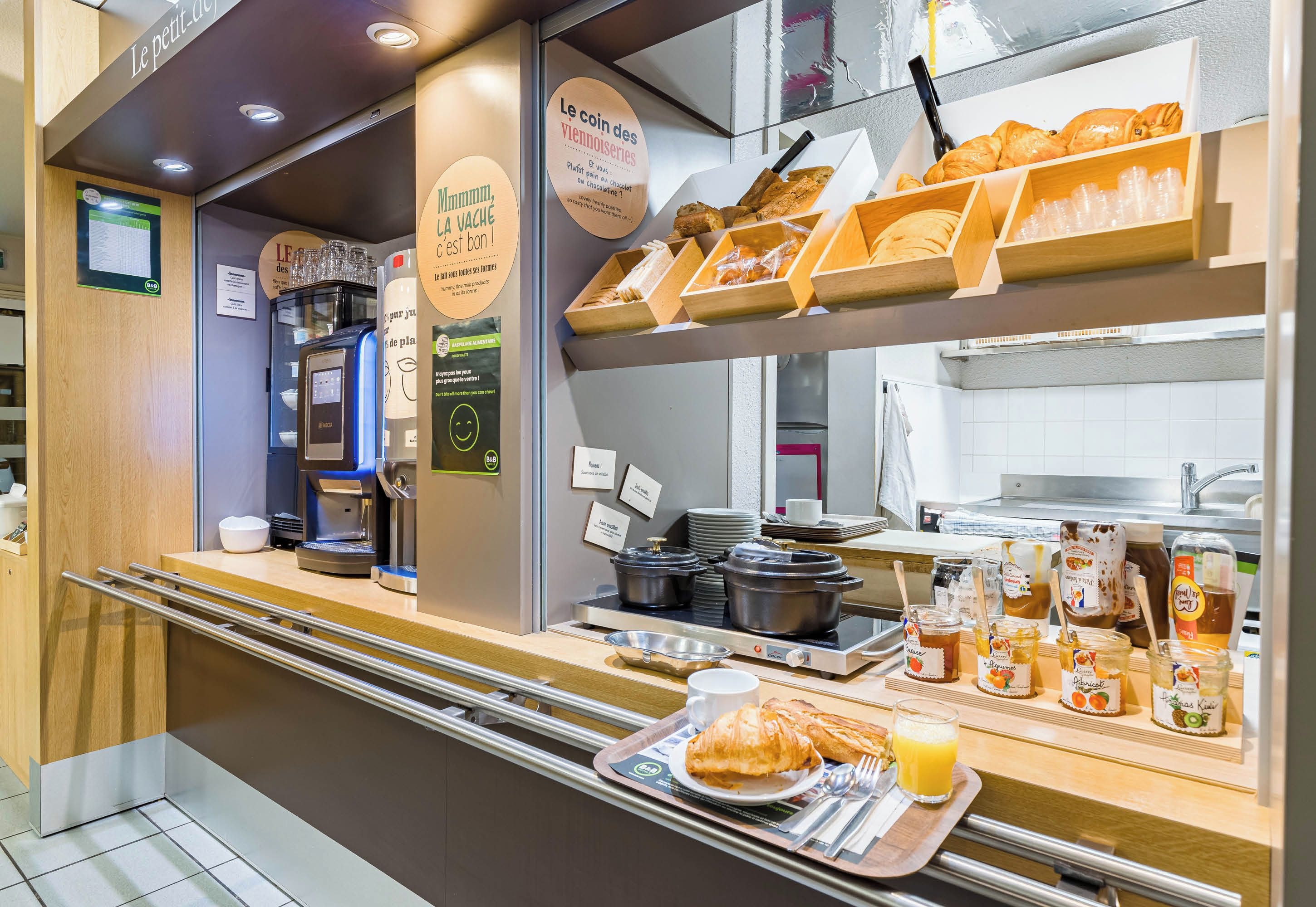 A breakfast buffet with various food items and beverages.