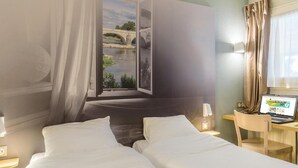 A hotel room with two beds, a desk with a laptop, and a view of a bridge over a river. - B&B Hotel Tours Nord 1 Val De Loire (Tours)