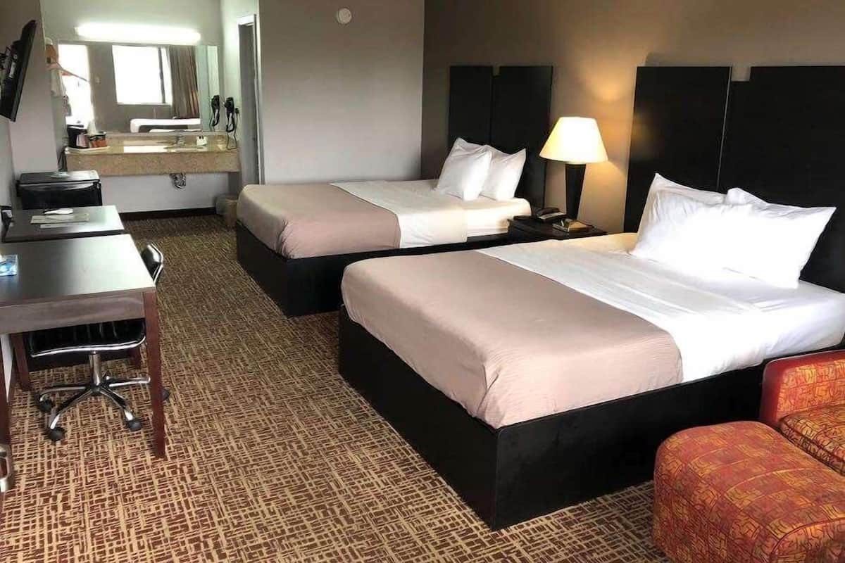Premium bedding, memory foam beds, desk, blackout drapes