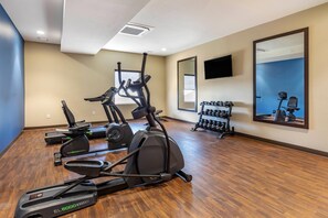 A gym with treadmills, elliptical machines, and a rack of dumbbells. - Comfort Inn & Suites Edgewood (Edgewood)