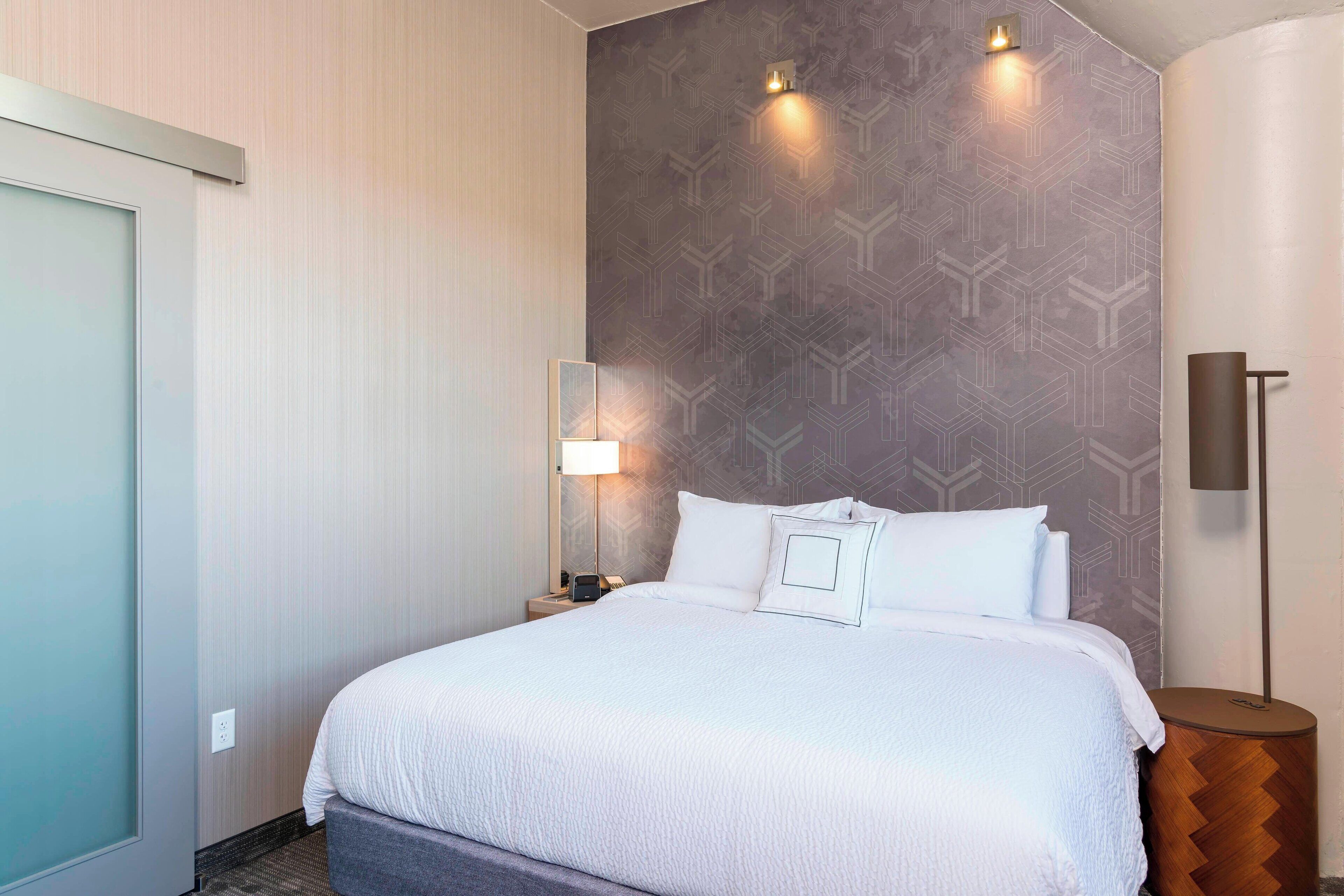 premium bedding, desk, laptop workspace, blackout curtains