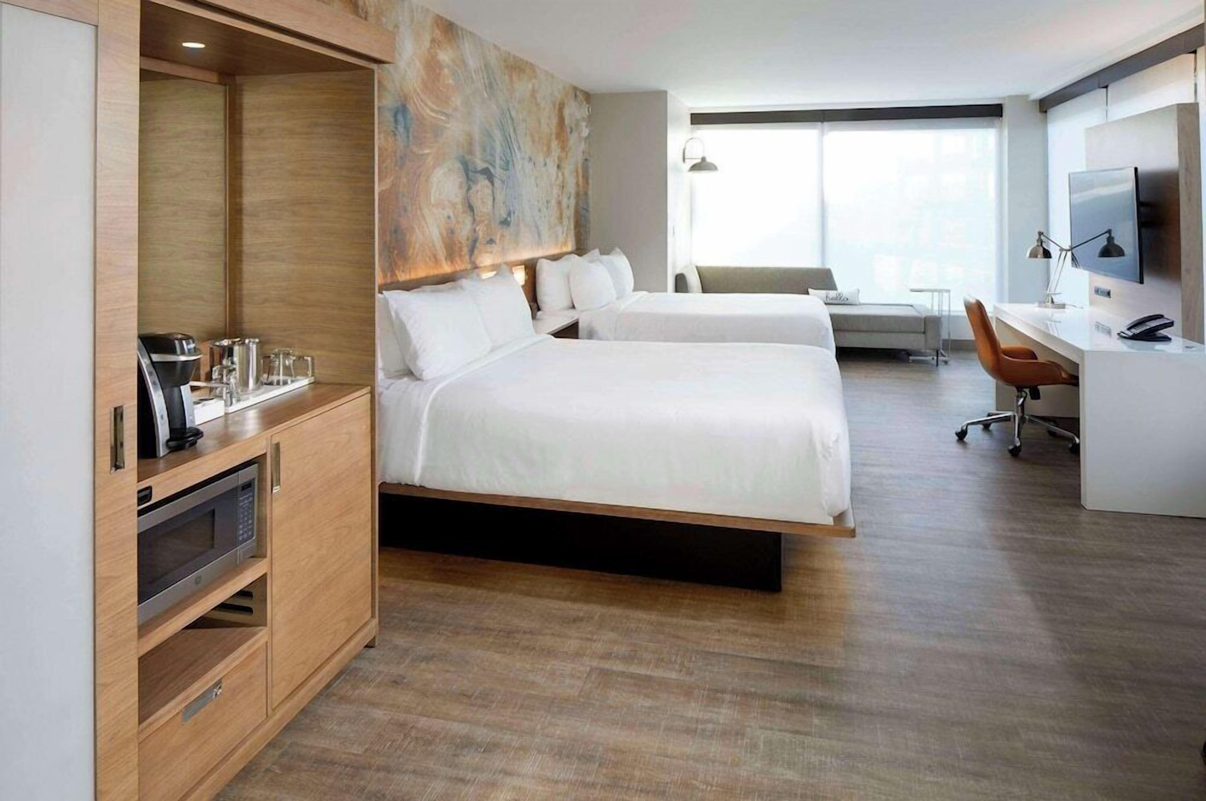 Premium bedding, desk, laptop workspace, iron/ironing board