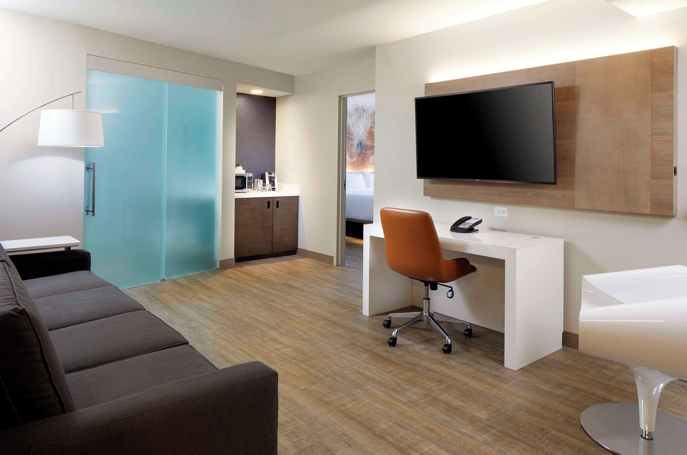 premium bedding, desk, laptop workspace, iron/ironing board