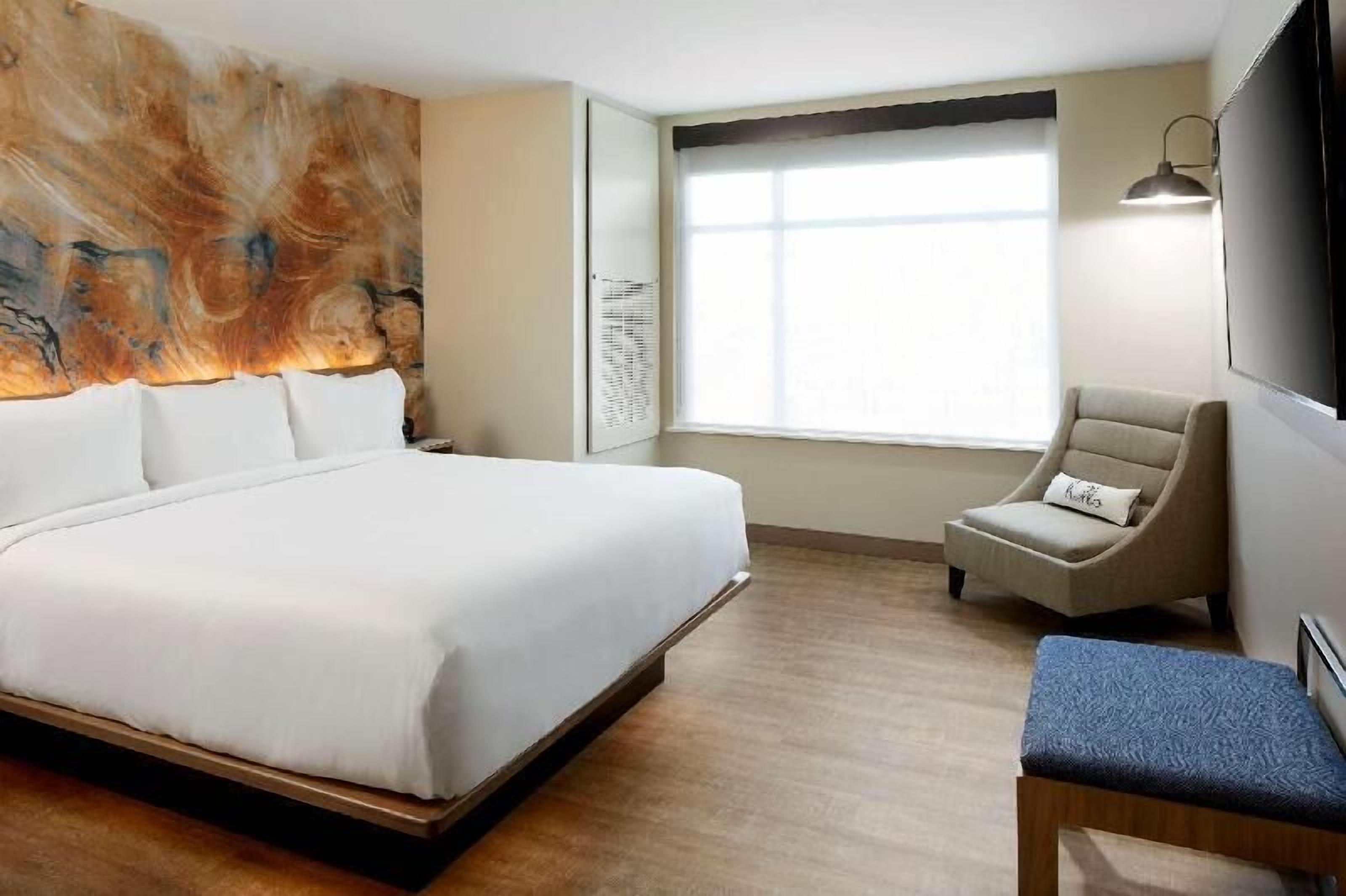 Premium bedding, desk, laptop workspace, iron/ironing board