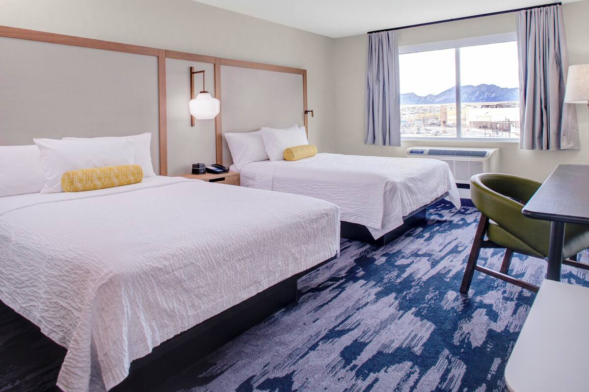 premium bedding, desk, laptop workspace, blackout curtains