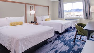 Premium bedding, desk, laptop workspace, blackout curtains