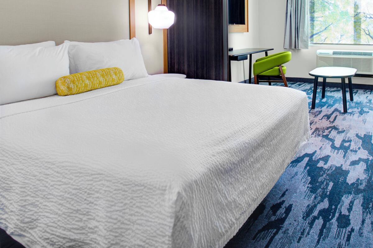 premium bedding, desk, laptop workspace, blackout curtains