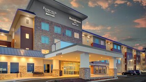 A Fairfield Inn & Suites Marriott hotel with a modern design, featuring a stone facade, multiple balconies, and a covered entrance. - Fairfield by Marriott Inn & Suites Boulder Broomfield/Interlocken (Broomfield)