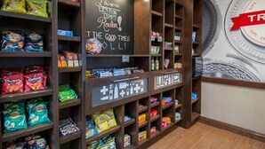A snack display with various chips and snacks.