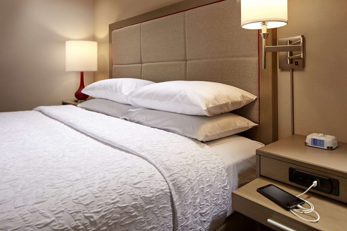 premium bedding, desk, laptop workspace, blackout curtains