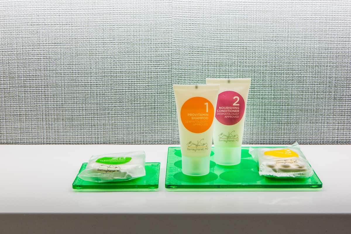 room, multiple beds (high floor, 2 double & sofa bed) | bathroom amenities | shower, designer toiletries, hair dryer, towels