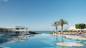 Outdoor pool, pool umbrellas, sun loungers