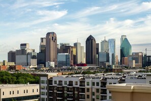 A city skyline with modern high-rise buildings and a mix of residential and commercial structures. - Canopy by Hilton Dallas Uptown (Dallas)
