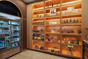 A hotel minibar with various beverages, snacks, and condiments. - Hotel Savoy Kansas City, Tapestry Collection by Hilton (Kansas City)
