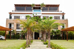 A modern two-story building with a sign reading "Beachrock."