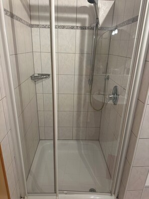 Bathtub, hair dryer, towels, soap