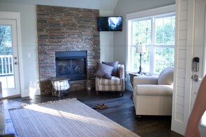 The Quarter House Cottage | Living area | Flat-screen TV, fireplace