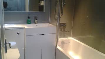 Combined shower/tub, hair dryer, towels, soap