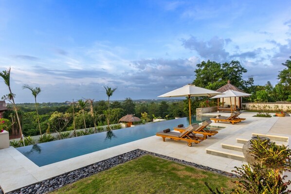 A lap pool, pool loungers