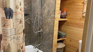 Combined shower/bathtub, hair dryer, towels, soap