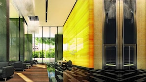 A modern lobby with a checkered floor, seating area, and a large yellow wall with the DORSETT RESIDENCES logo. - Dorsett Residences Bukit Bintang at Dorsett Kuala Lumpur (Kuala Lumpur)