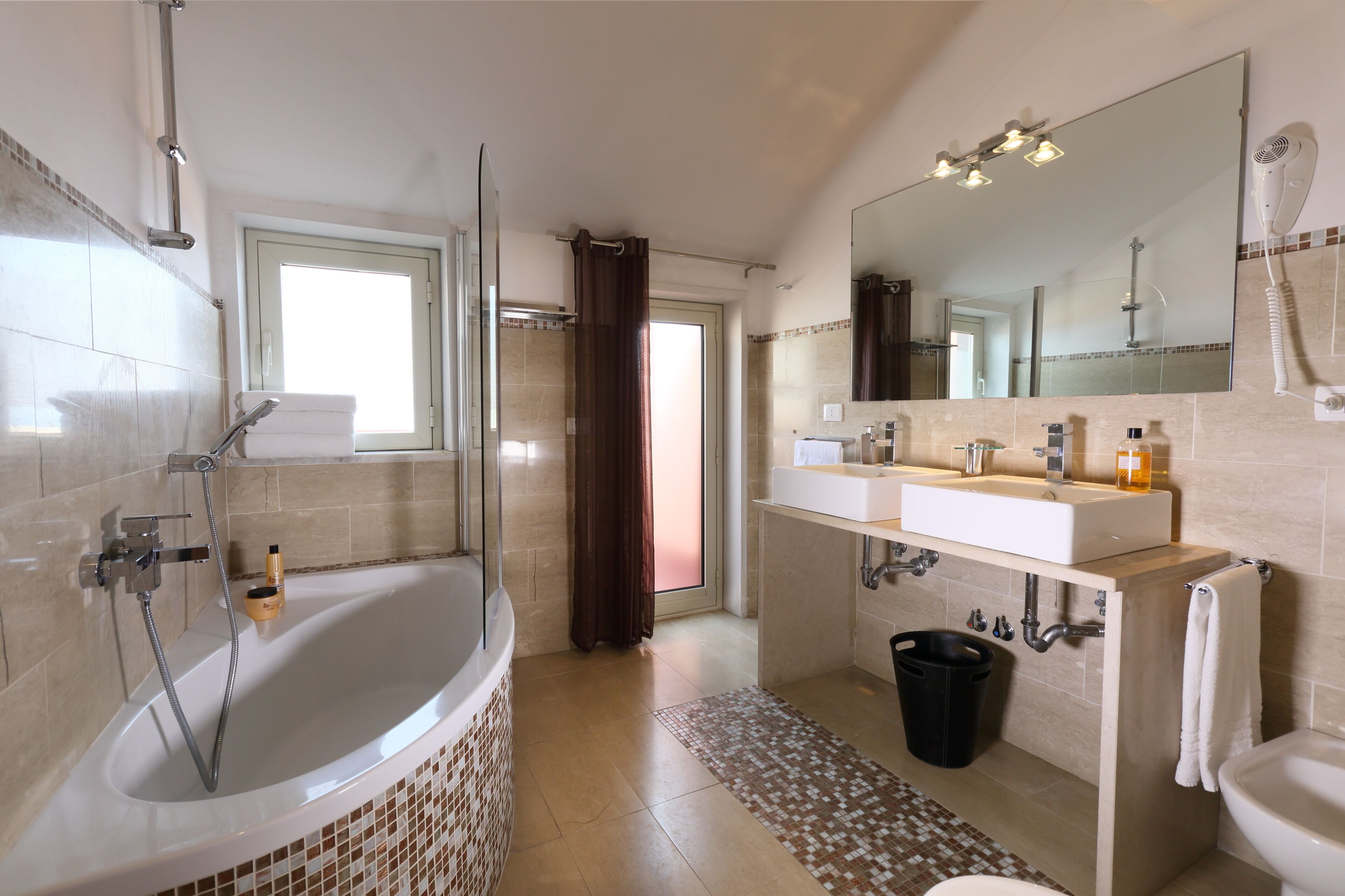 Bathtub, hair dryer, bidet, towels