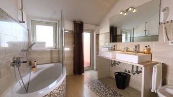 Bathtub, hair dryer, bidet, towels