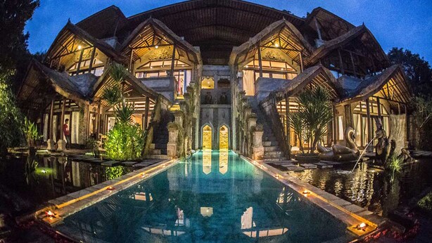 A large, multi-story building with a central courtyard and a swimming pool. - Avalon Ubud Villas (Ubud)