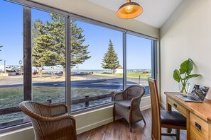 Two-Bedroom Ground Floor Apartment with Ocean View - De Mole | Living area | Flat-screen TV, fireplace - Bonnies of Beachport (Beachport)