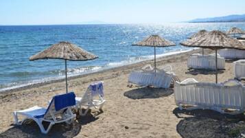 On the beach, sun-loungers, beach umbrellas