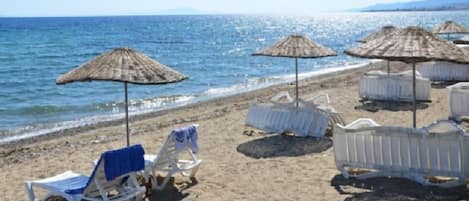 On the beach, sun-loungers, beach umbrellas
