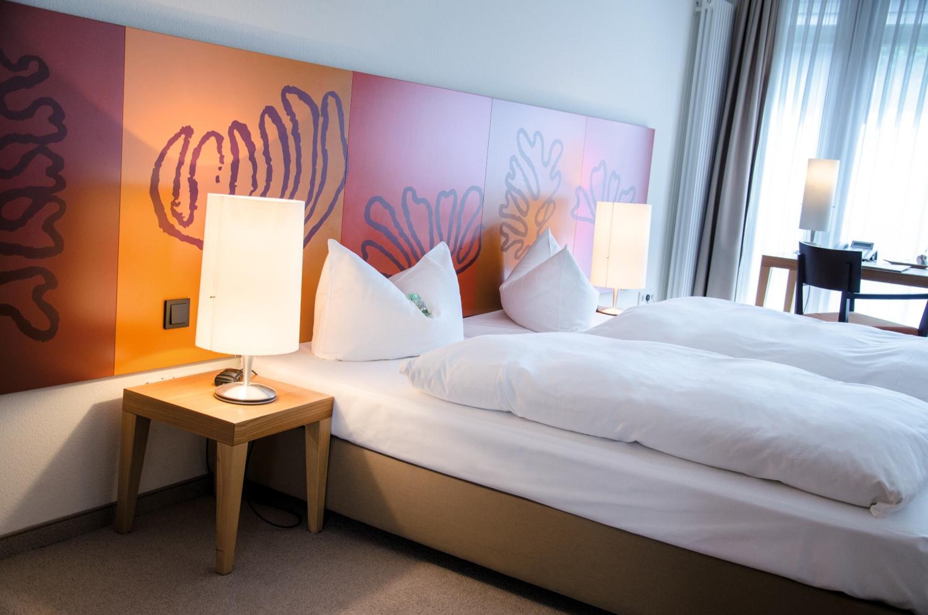 premium bedding, desk, laptop workspace, blackout curtains