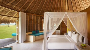 A room with a bed, a seating area, and a view of the outdoors. - Jetwing Surf & Safari, A Luxury Reserve (Pottuvil)