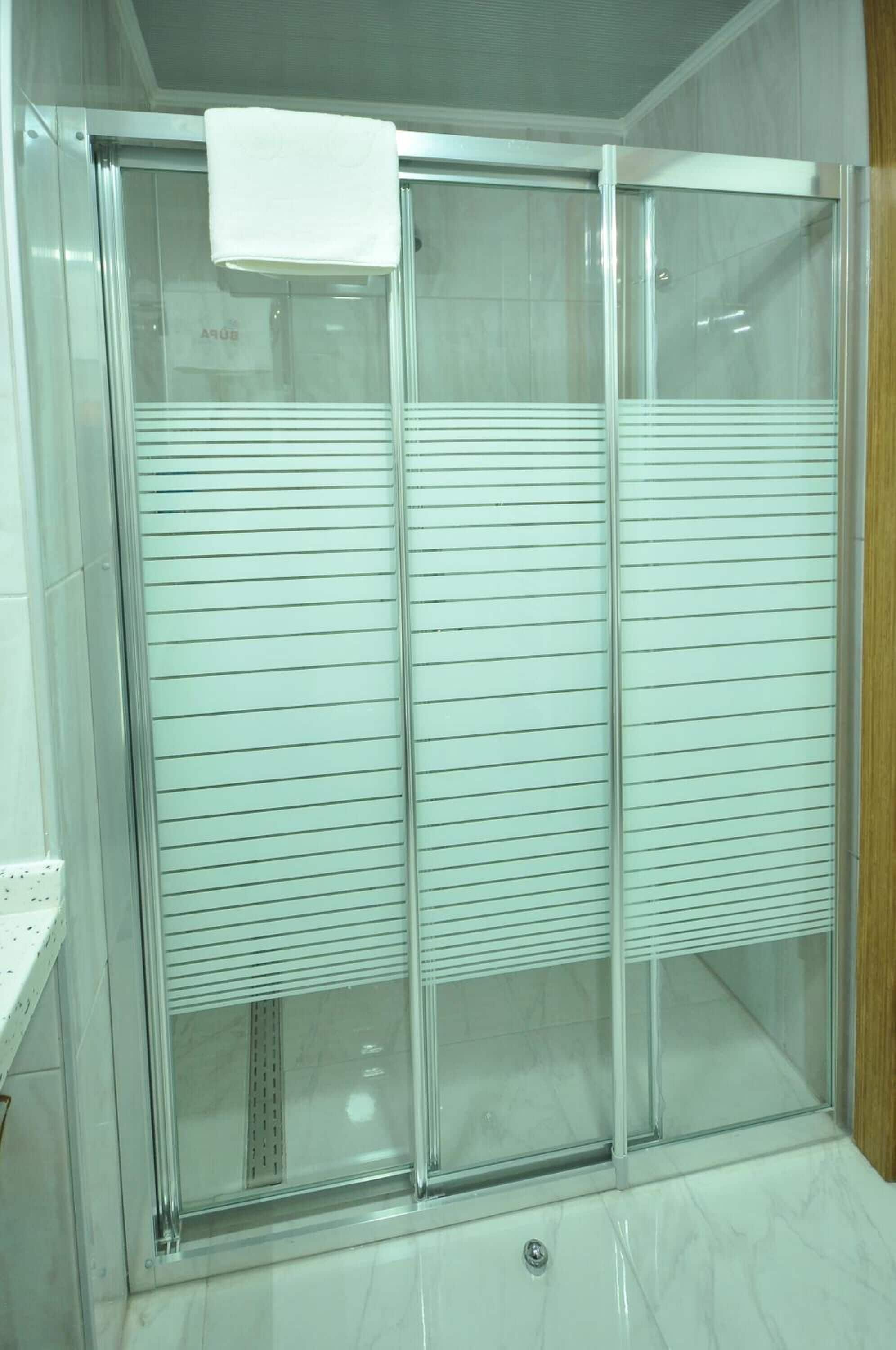 shower, free toiletries, slippers, towels