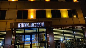 A hotel with illuminated signage reading "BUPA HOTEL" and multiple lit windows. - Bupa Hotel (Kayseri)