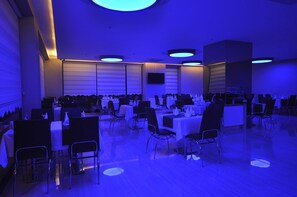 A large indoor dining area with tables and chairs arranged for a banquet. - Bupa Hotel (Kayseri)