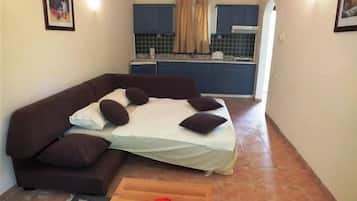 Apartamento, 1 quarto | Área de estar | TV LCD