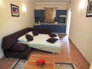Apartment, 1 Bedroom | Living area | LCD TV