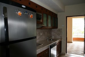 Fridge, microwave, stovetop, coffee/tea maker