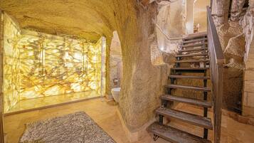 Grand Suite (Cave) | Bathroom | Combined shower/tub, jetted tub, hair dryer, heated floors