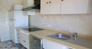 A kitchen with a dishwasher, a double sink, and cabinets. - House in Lloret de Mar - 104020 by MO Rentals (Vidreres)