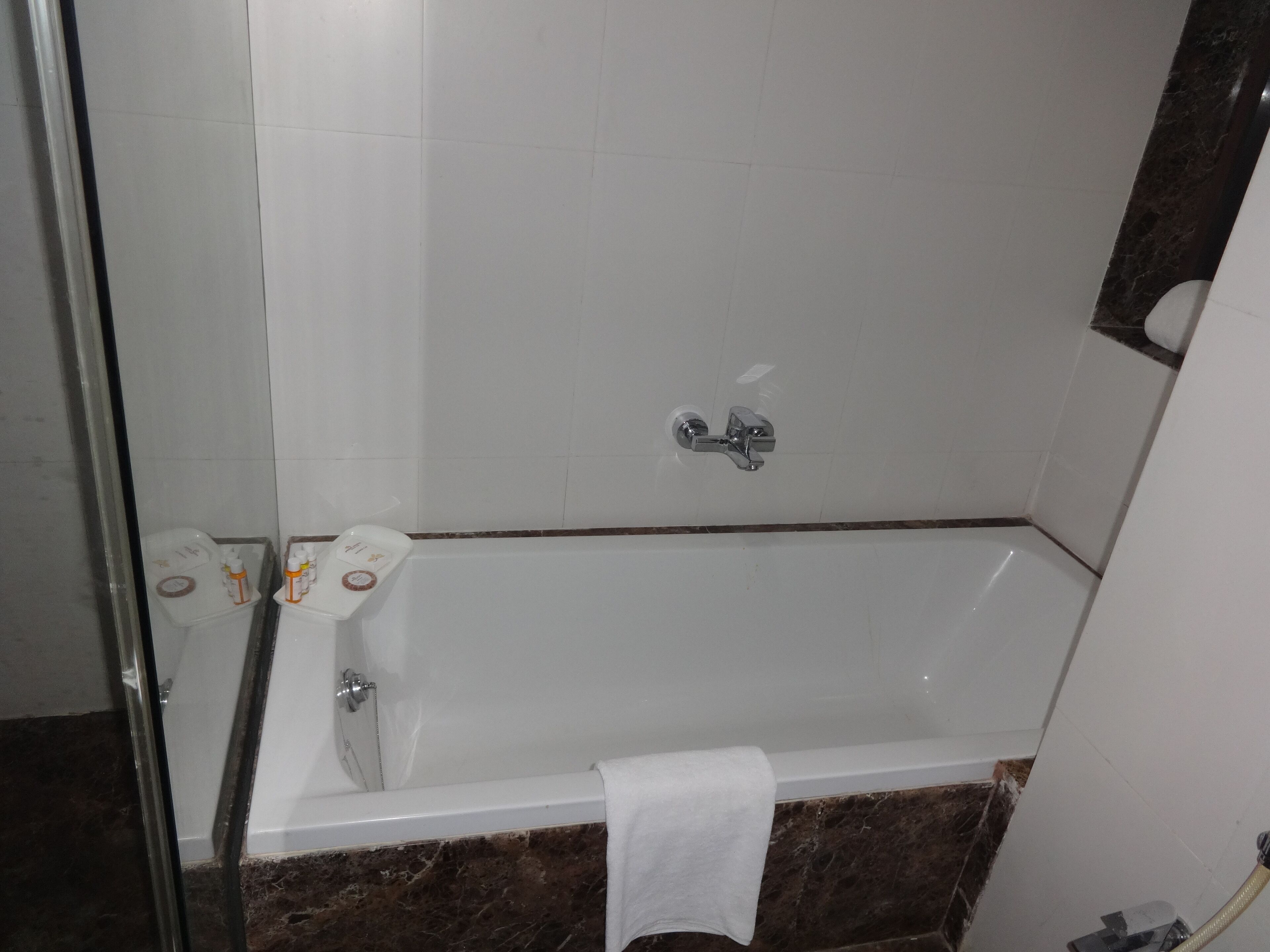 A bathroom with a bathtub, a shower, and a toilet.