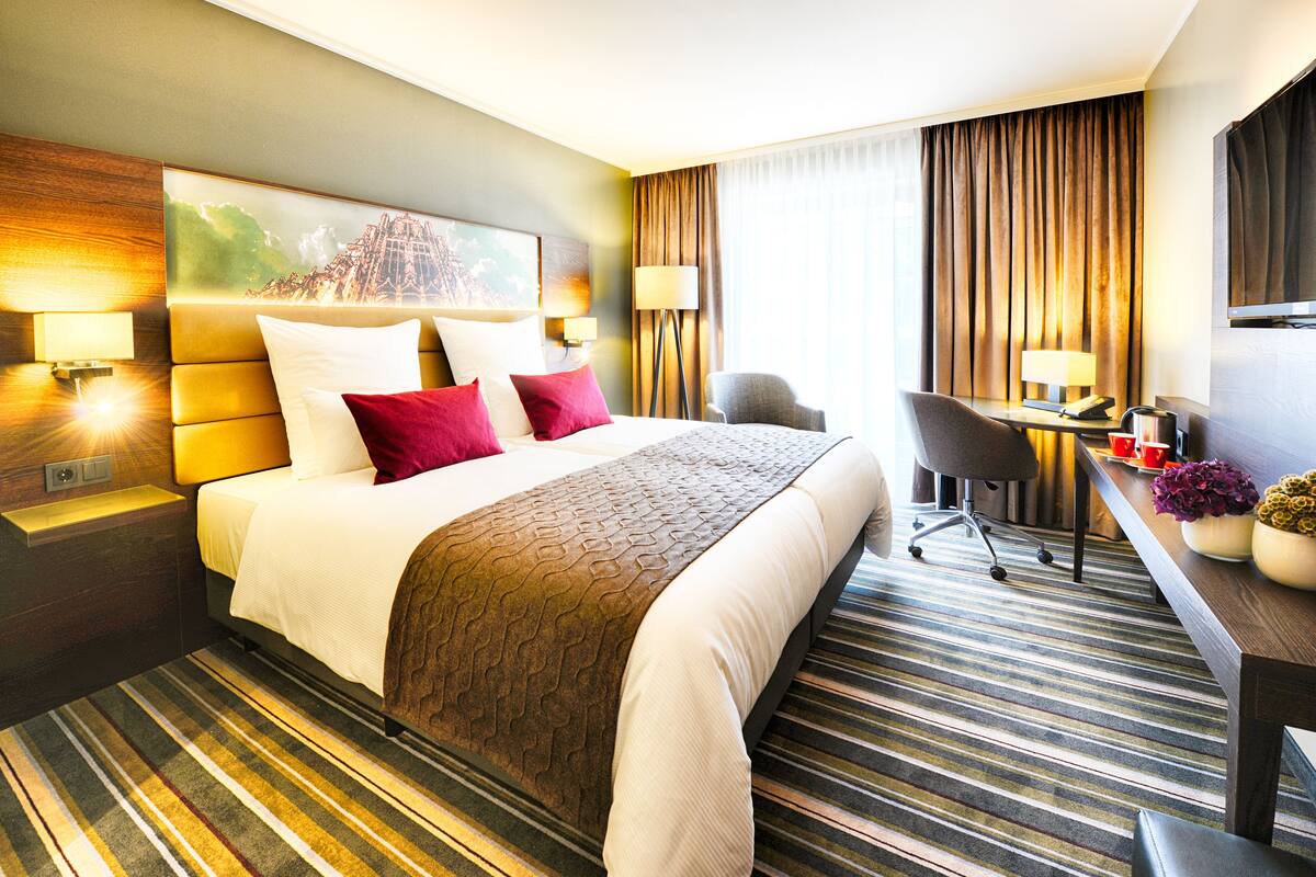 comfort room | 1 bedroom, minibar, in-room safe, desk