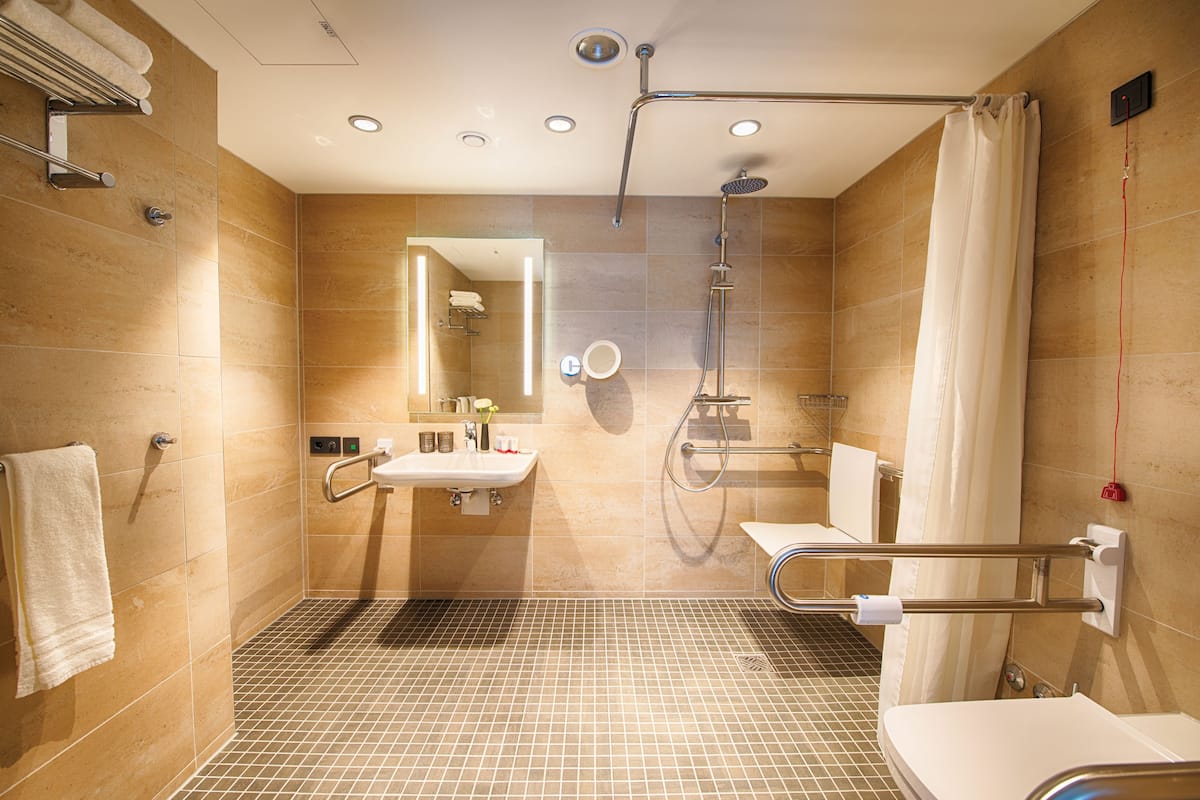 rainfall showerhead, designer toiletries, hair dryer, towels