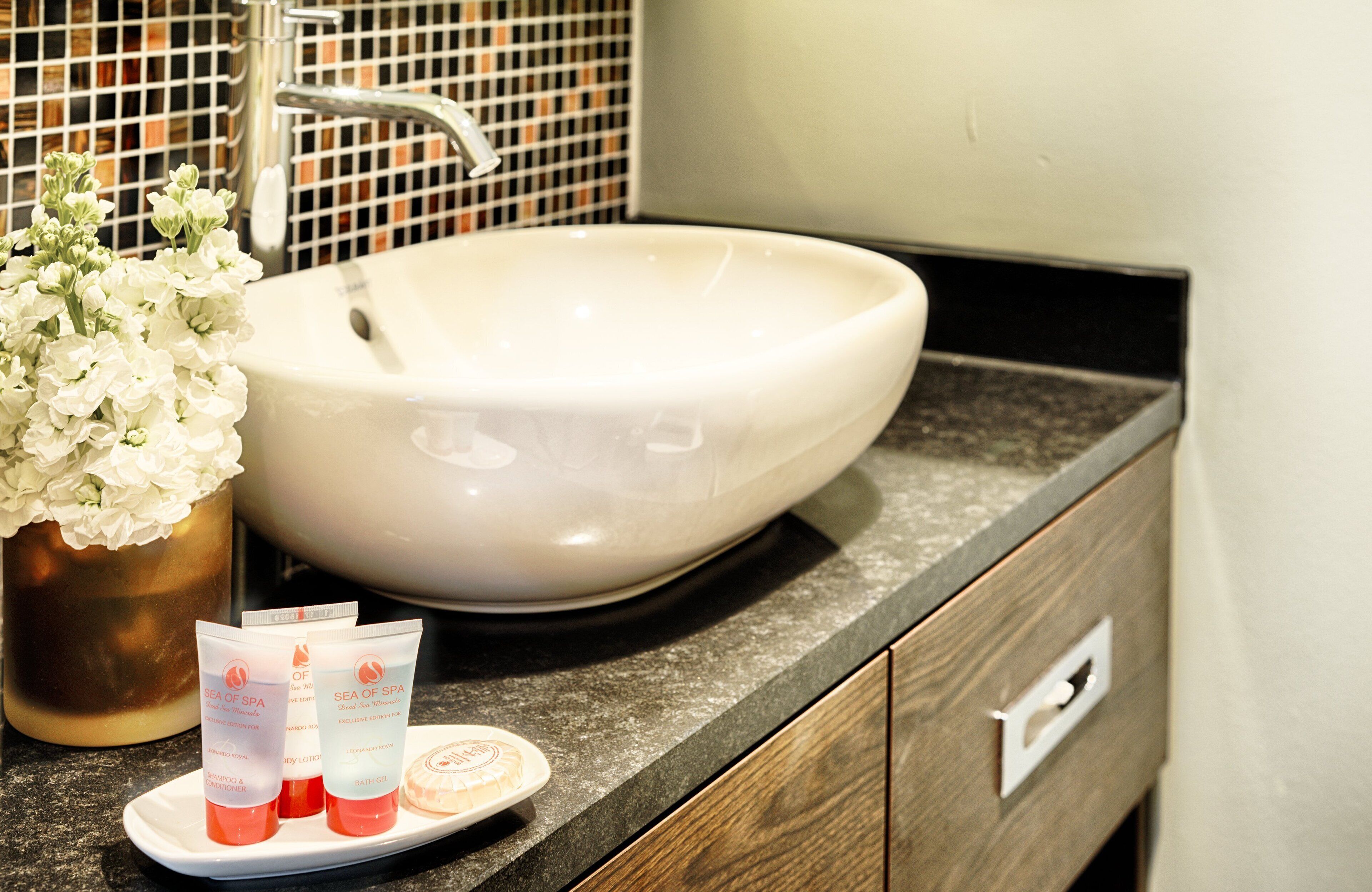 rainfall showerhead, designer toiletries, hair dryer, towels