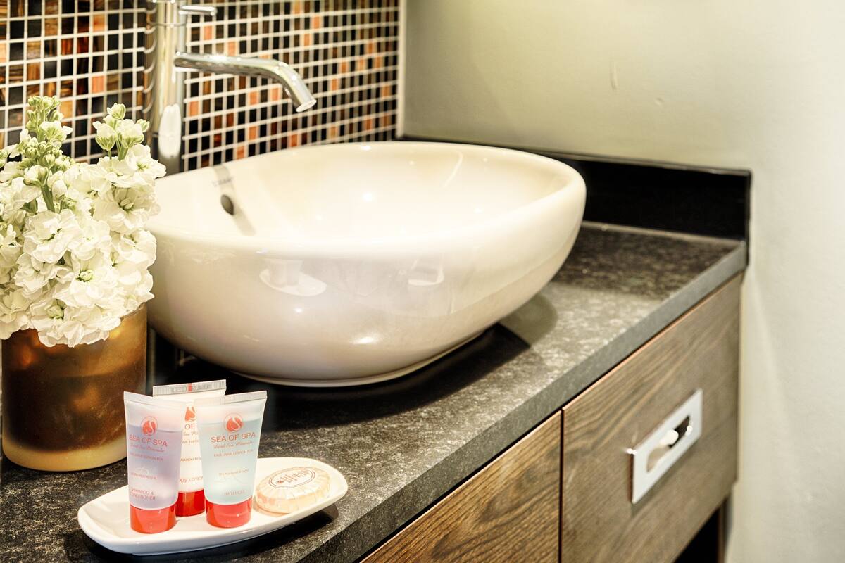 rainfall showerhead, designer toiletries, hair dryer, towels